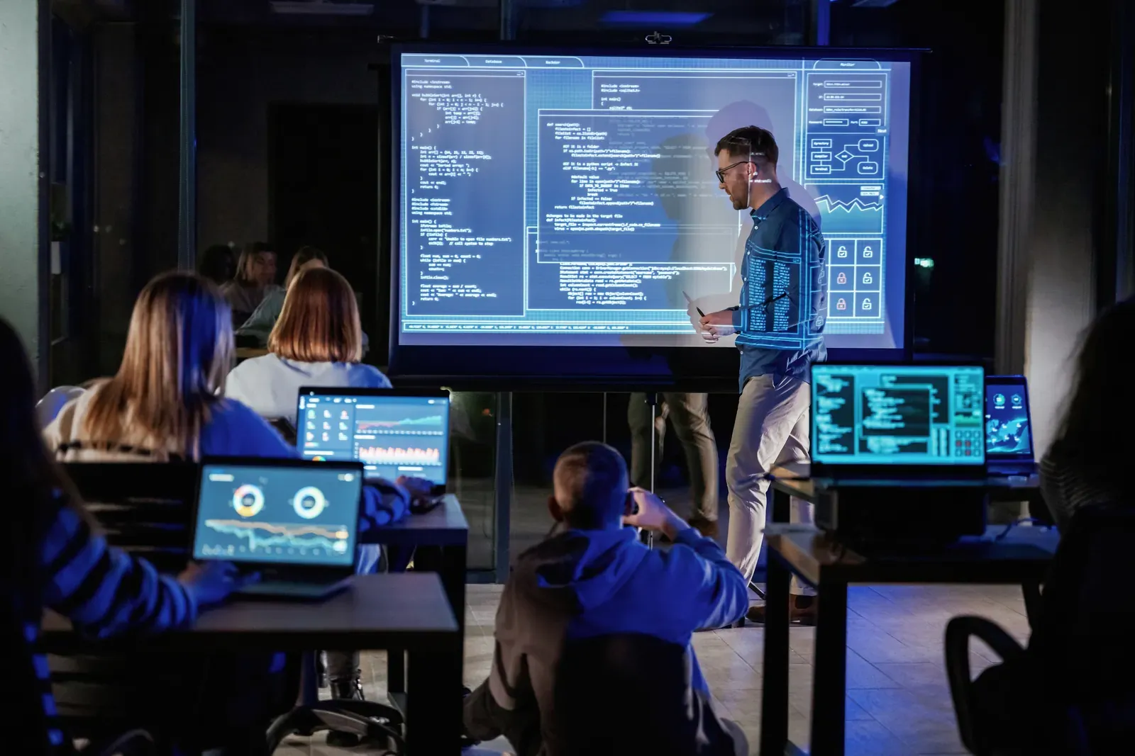 Instructor guiding participants through a hands-on cybersecurity training exercise