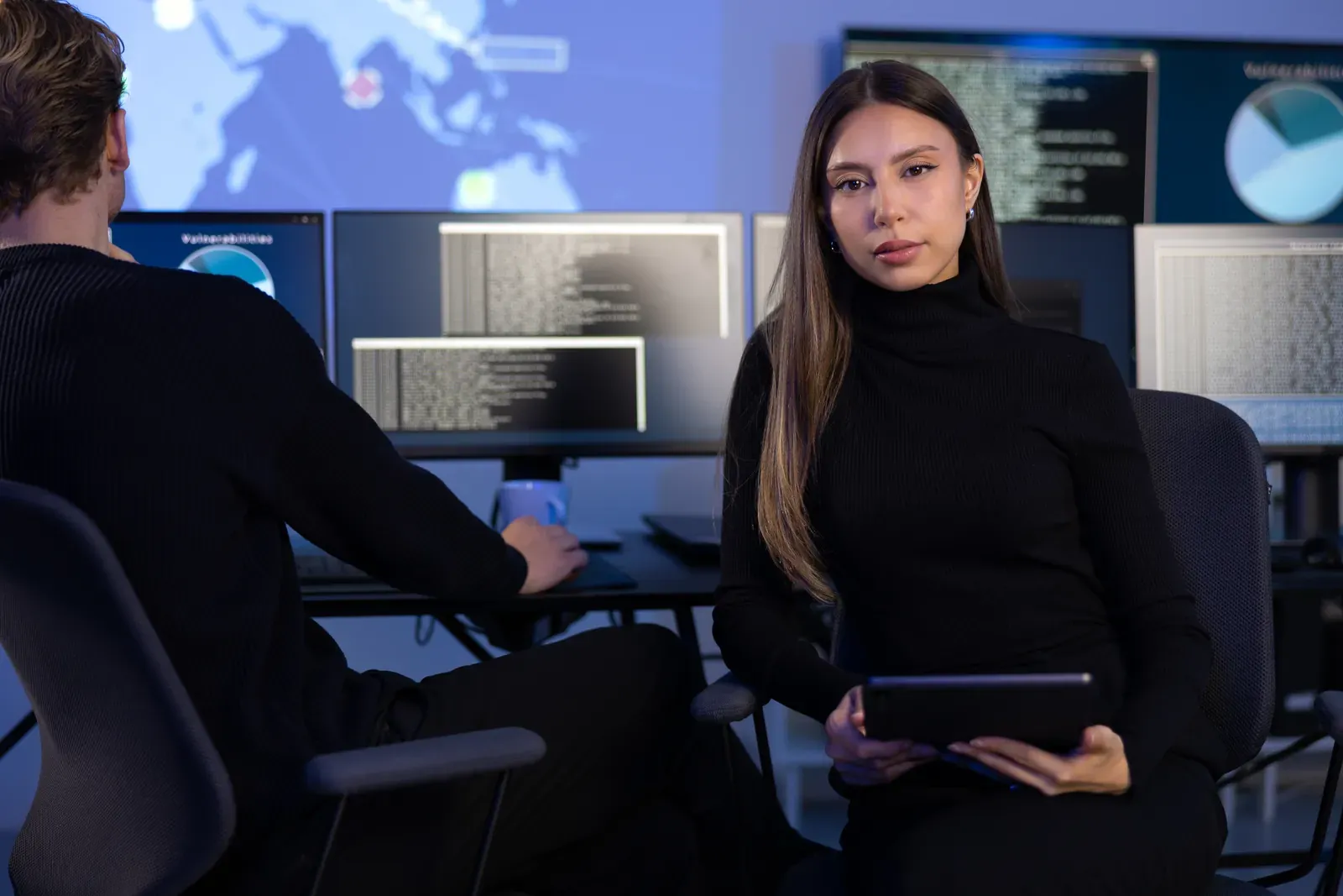 Security operations analysts monitoring detections across multiple screens